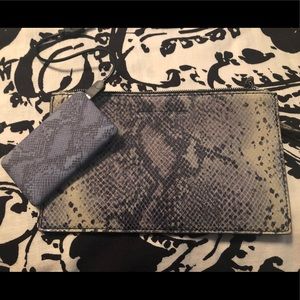 Clutch purse with portable cell phone charger